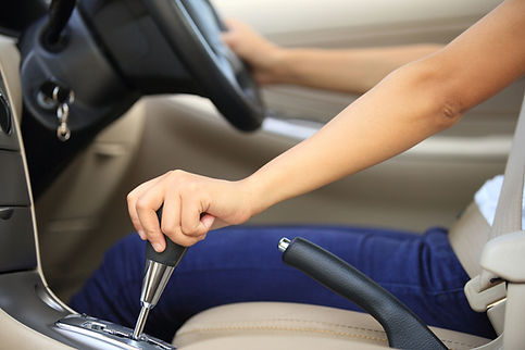 woman driver shifting the gear stick