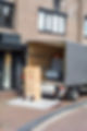 Small grey trucks on a town sidewalk It is used to haul shoes and other goods to the crow