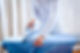 A professional ironing a blue shirt