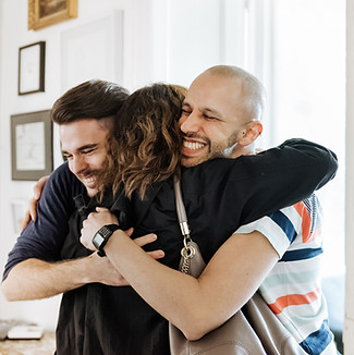 Couple Hugging Friend