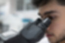 Man using microscope