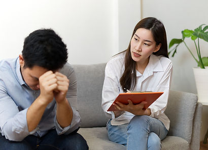 Nutritionist attentively listening to a stressed client during a one-on-one consultation, offering emotional and lifestyle gu