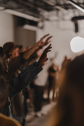 People Raising Hands