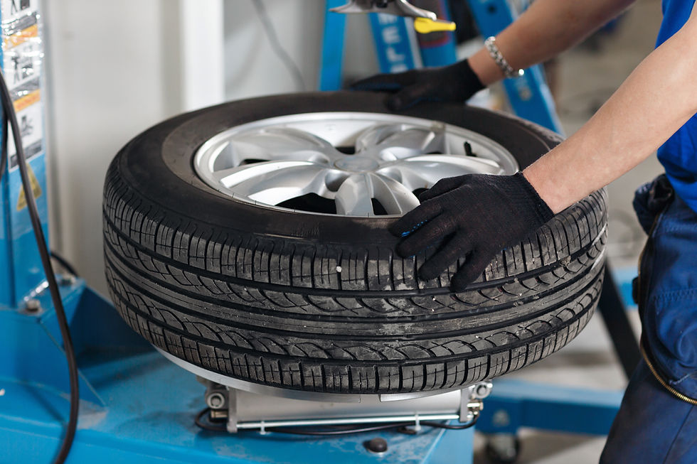 Mechanic changing car tyre