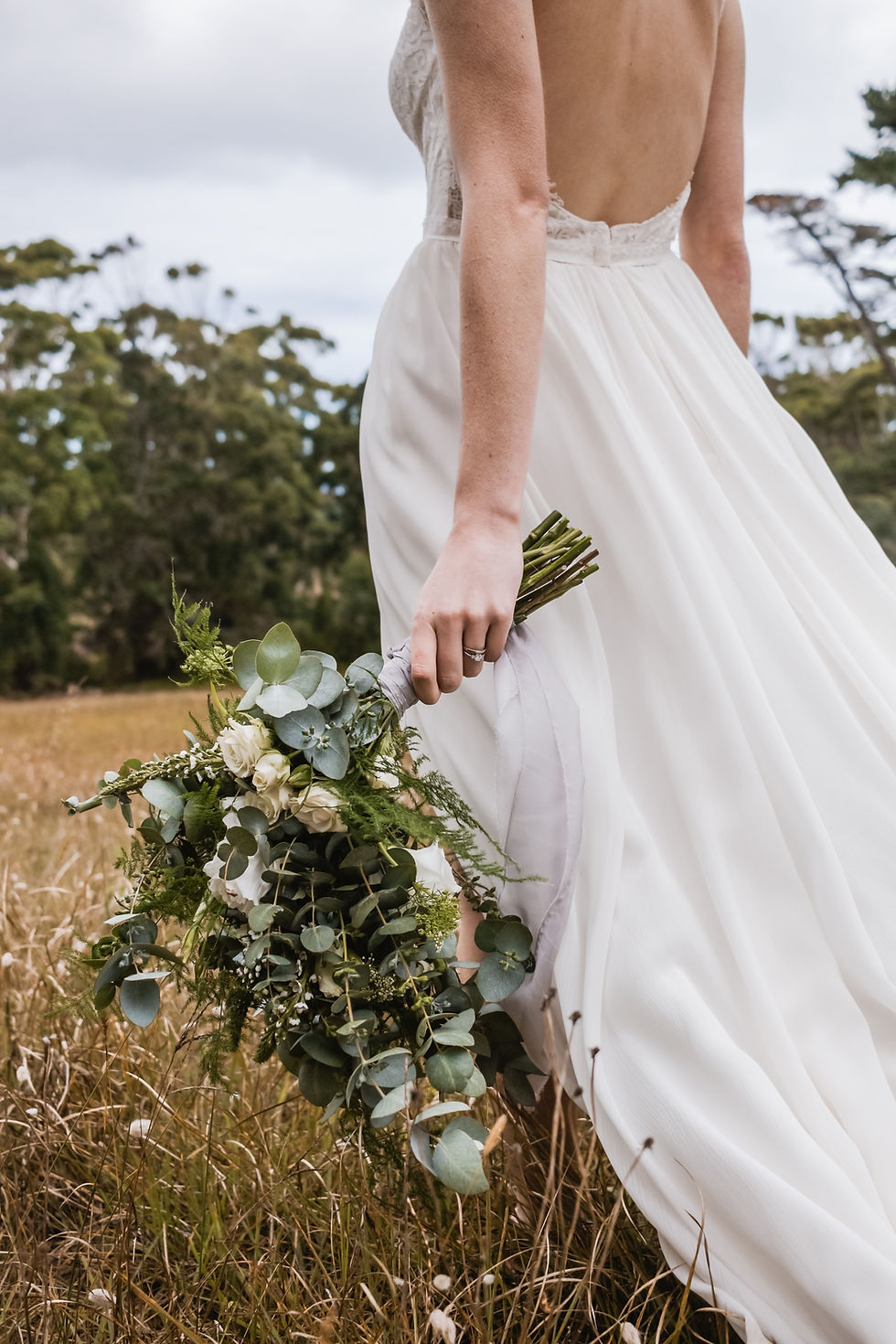 Bride holding floral bouquet