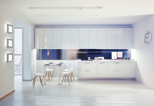 Sleek minimalist white kitchen design with a central dining table and contemporary cupboards