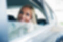woman in car speaking on phone