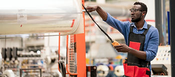 Industrial Worker Operating Machine