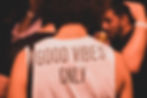 Photo of someone who as a shirt that says "Good Vibes"