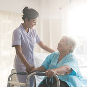 A nurse taking care of ole patient