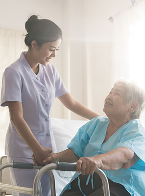 A nurse taking care of ole patient