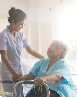 A nurse taking care of ole patient