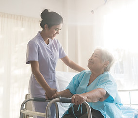 A nurse taking care of ole patient