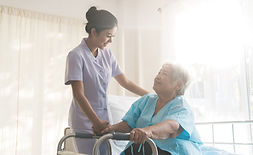 A nurse taking care of ole patient