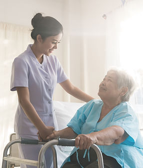 A nurse taking care of ole patient