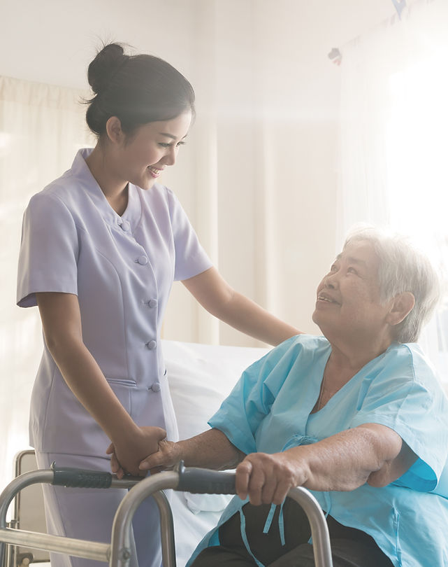 A nurse taking care of ole patient