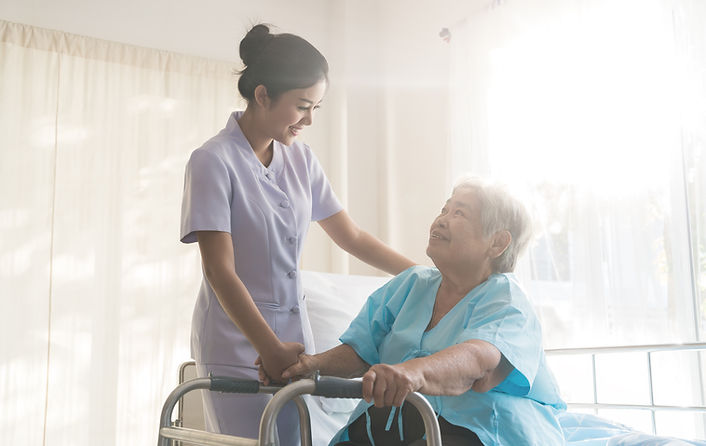 A nurse taking care of ole patient
