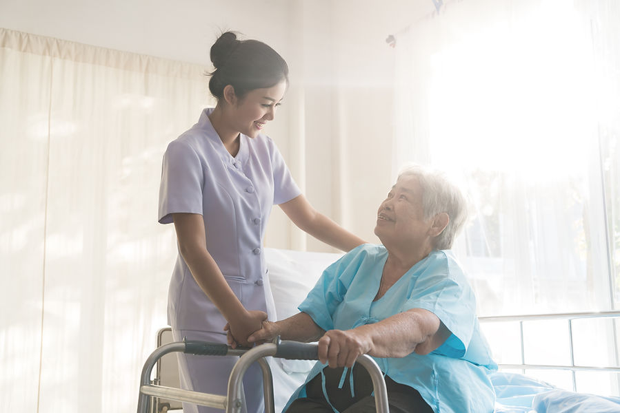 A nurse taking care of ole patient