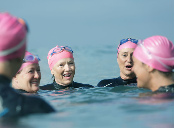 Swimmers talking in the sea