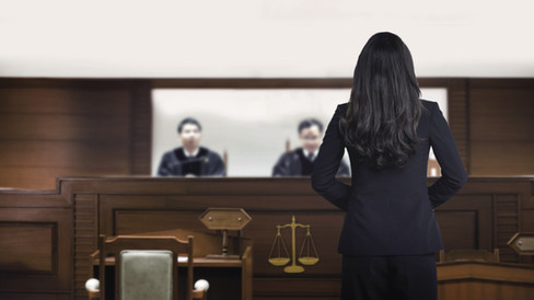 A witness in court providing a statement.