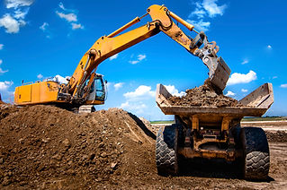 Excavator loading dumper truck tipper in