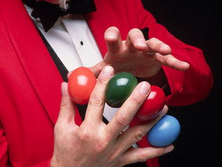 A man juggling bright coloured balls