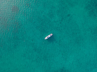 Boat In Turquoise Water
