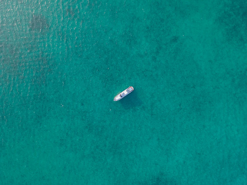 Boat In Turquoise Water
