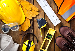 Personal protective workwear and blueprint with some measuring instruments