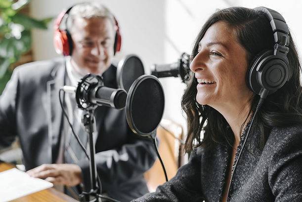 A Man and a woman participating in a radio show