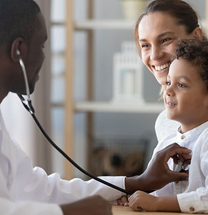 Doctor examining young boy for potential allergies, asthma or wheeze