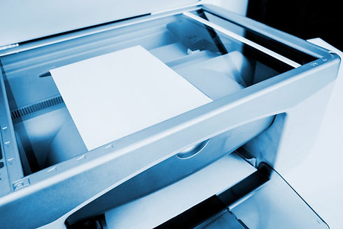 Close-up view of an open scanner tray lid on an office photocopier machine