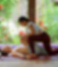 A woman giving a man a massage
