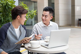 Two guys discussing between coffee time