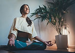 Woman Meditating Indoors