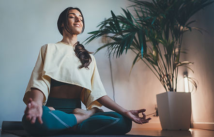 Person practicing Qi meditation surrounded by peaceful energy, enhancing focus and inner harmony.