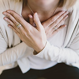 Hands on chest