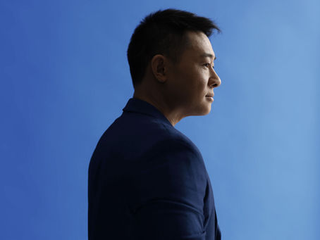 The Man Behind the Blue Curtain