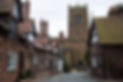 Period properties in front of church