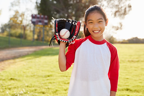 Girl Holding Baseball