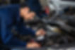 Mechanic Examining Engine