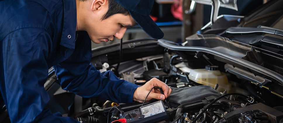 Mechanic Examining Engine