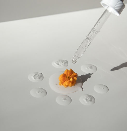 Dropper and flower close-up