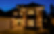 A beautifully built new home photographed in the early evening with all of the house light