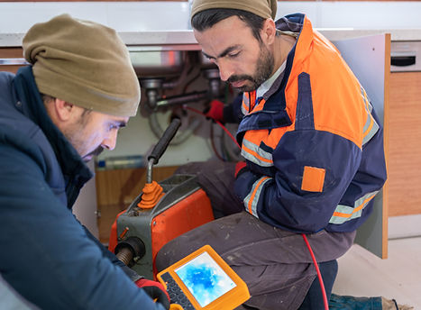 Plumbers Checking Kitchen Sink Pipe With Video Borescope Inspection Camera