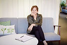 Woman on the sofa with notes