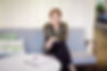 Woman on the sofa with notes