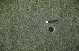 Golf Ball Near Hole