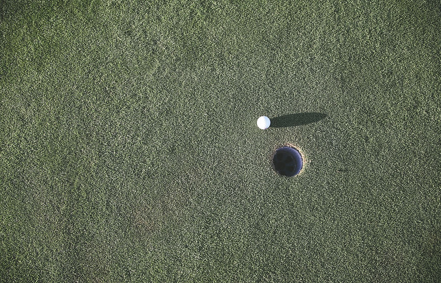 Golf Ball Near Hole