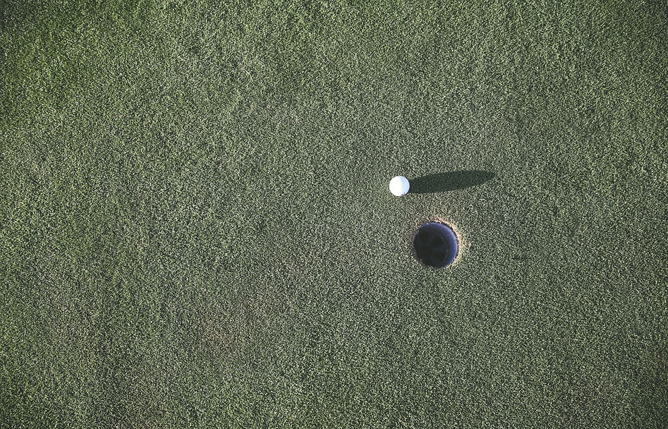 Golf Ball Near Hole